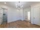 Bright bedroom with hardwood floors and modern lighting, offering a serene and inviting space at 585 Sherwood Ne Rd, Atlanta, GA 30324