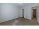 A bedroom featuring light-colored wood flooring and a doorway leading to another room at 585 Sherwood Ne Rd, Atlanta, GA 30324