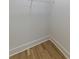 Walk-in closet with wire shelving and hardwood floors at 585 Sherwood Ne Rd, Atlanta, GA 30324