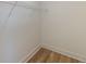 Walk-in closet with wire shelving and hardwood floors at 585 Sherwood Ne Rd, Atlanta, GA 30324
