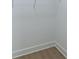 A closet featuring white shelving and light-colored wood flooring at 585 Sherwood Ne Rd, Atlanta, GA 30324