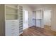 Well-organized walk-in closet with adjustable shelving and drawers to maximize storage and organization at 585 Sherwood Ne Rd, Atlanta, GA 30324