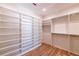 This walk-in closet has custom shelving, hanging racks, and a spacious layout at 585 Sherwood Ne Rd, Atlanta, GA 30324