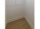 A walk in closet featuring light wood flooring and white walls ready for customization at 585 Sherwood Ne Rd, Atlanta, GA 30324