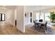 Bright dining room featuring hardwood floors, modern chandelier, and elegant decor, perfect for Gathering gatherings at 585 Sherwood Ne Rd, Atlanta, GA 30324