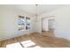 Bright dining room with hardwood floors, large window, and modern chandelier at 585 Sherwood Ne Rd, Atlanta, GA 30324