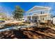 Charming two-story home featuring a welcoming front porch with brick accents and a well-manicured lawn at 585 Sherwood Ne Rd, Atlanta, GA 30324