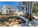 Beautiful exterior view of the home's architecture with well-manicured lawn and mature trees at 585 Sherwood Ne Rd, Atlanta, GA 30324