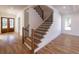 A bright foyer and staircase welcome you into this home with hardwood floors and trim at 585 Sherwood Ne Rd, Atlanta, GA 30324
