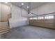 Spacious garage with access to a stairway at 585 Sherwood Ne Rd, Atlanta, GA 30324