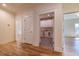 Hallway features gleaming hardwood floors, white trim and access to the laundry room at 585 Sherwood Ne Rd, Atlanta, GA 30324