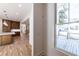 Kitchen view from a large window with wood floors and custom cabinets at 585 Sherwood Ne Rd, Atlanta, GA 30324