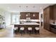 Spacious kitchen with an island, stools, and modern cabinetry at 585 Sherwood Ne Rd, Atlanta, GA 30324