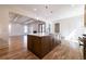 Open concept kitchen featuring a large island with hardwood floors at 585 Sherwood Ne Rd, Atlanta, GA 30324