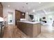 Bright, open kitchen with a large island, pendant lighting, and modern stainless steel appliances at 585 Sherwood Ne Rd, Atlanta, GA 30324