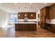 Spacious kitchen with island, custom cabinetry, modern appliances, and hardwood floors at 585 Sherwood Ne Rd, Atlanta, GA 30324