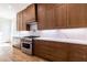 Kitchen featuring wood cabinets and stainless appliances at 585 Sherwood Ne Rd, Atlanta, GA 30324