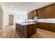 Modern kitchen with wood cabinets and large center island at 585 Sherwood Ne Rd, Atlanta, GA 30324