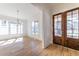 Bright living area featuring hardwood floors, large windows, and stylish modern lighting at 585 Sherwood Ne Rd, Atlanta, GA 30324