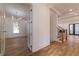 Spacious living area featuring hardwood floors, a modern chandelier, and ample natural light at 585 Sherwood Ne Rd, Atlanta, GA 30324