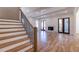 Spacious living room with hardwood floors, fireplace, and natural light from the staircase at 585 Sherwood Ne Rd, Atlanta, GA 30324