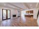 Bright living room with marble fireplace, hardwood floors, and a view of the kitchen at 585 Sherwood Ne Rd, Atlanta, GA 30324