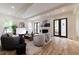 Inviting living room featuring hardwood floors, a fireplace, and comfortable seating arrangements, perfect for relaxation at 585 Sherwood Ne Rd, Atlanta, GA 30324