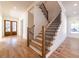 Bright living room with staircase and wood floors at 585 Sherwood Ne Rd, Atlanta, GA 30324