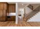 Open floor plan with kitchen cabinetry and staircase at 585 Sherwood Ne Rd, Atlanta, GA 30324