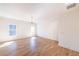 Well-lit living room featuring hardwood floors, crown moulding and large windows that bring in an abundance of natural light at 585 Sherwood Ne Rd, Atlanta, GA 30324