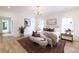 Stylishly furnished main bedroom with hardwood floors, crown molding, and plentiful natural light at 585 Sherwood Ne Rd, Atlanta, GA 30324