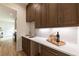 Butler's pantry featuring custom wood cabinetry, marble countertops, and stylish fixtures at 585 Sherwood Ne Rd, Atlanta, GA 30324
