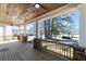 Inviting porch with a stained wood ceiling, ceiling fans, and views of the surrounding neighborhood at 585 Sherwood Ne Rd, Atlanta, GA 30324