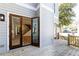 Rear exterior view with wood deck and access to the house through glass doors at 585 Sherwood Ne Rd, Atlanta, GA 30324