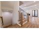 Open staircase showcasing hardwood floors and modern railing at 585 Sherwood Ne Rd, Atlanta, GA 30324