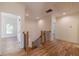 Second floor landing features wooden stairs, iron railings, and hardwood floors at 585 Sherwood Ne Rd, Atlanta, GA 30324