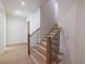 Staircase with wood treads, metal railings, and white walls at 585 Sherwood Ne Rd, Atlanta, GA 30324