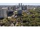 Stunning aerial view of a suburban neighborhood, with green tree coverage and a distant skyline view at 700 Park Regency Ne Pl # 803, Atlanta, GA 30326