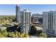 Wonderful aerial view of high-rise buildings, trees, and city skyline, with great rooftop amenities at 700 Park Regency Ne Pl # 803, Atlanta, GA 30326