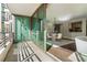 Balcony view with an adjacent dining room featuring an open layout and modern chandelier at 700 Park Regency Ne Pl # 803, Atlanta, GA 30326