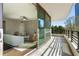 Relaxing balcony view with an adjacent living room featuring an open layout and ceiling fan at 700 Park Regency Ne Pl # 803, Atlanta, GA 30326