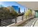 An inviting balcony view overlooking the city skyline with modern railing at 700 Park Regency Ne Pl # 803, Atlanta, GA 30326