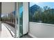 A beautiful balcony with city views features a tile floor and black metal railing at 700 Park Regency Ne Pl # 803, Atlanta, GA 30326