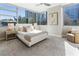 Bright bedroom featuring large windows, soft carpet, and modern furnishings at 700 Park Regency Ne Pl # 803, Atlanta, GA 30326