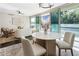 Dining area with natural light and a seamless transition to the living area with comfortable seating at 700 Park Regency Ne Pl # 803, Atlanta, GA 30326