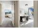 Hallway with an office on one side and a bedroom with a bed on the other at 700 Park Regency Ne Pl # 803, Atlanta, GA 30326