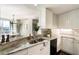 Kitchen featuring granite countertops, updated cabinets, and a stainless steel sink at 700 Park Regency Ne Pl # 803, Atlanta, GA 30326