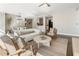 Cozy living room with comfortable furniture, a stylish rug, and an open floor plan to the kitchen at 700 Park Regency Ne Pl # 803, Atlanta, GA 30326