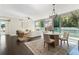 Airy living room featuring a dining area, large windows, and sophisticated decor at 700 Park Regency Ne Pl # 803, Atlanta, GA 30326