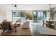 Bright living room boasts floor-to-ceiling windows, modern furnishings, and an open layout at 700 Park Regency Ne Pl # 803, Atlanta, GA 30326